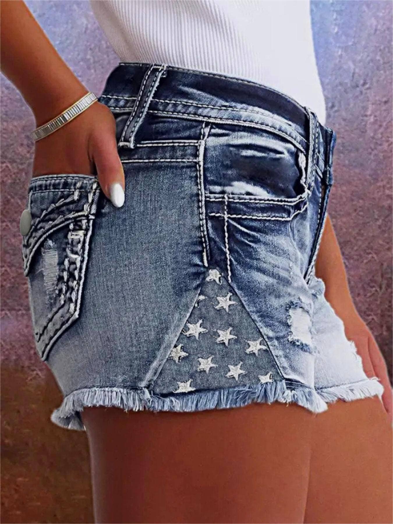 Mid rise ripped denim shorts